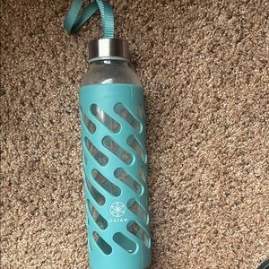 Gaiam glass water bottle with stainless steel cover and carry ribbon